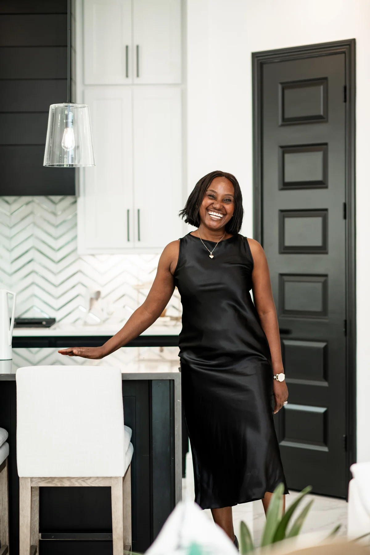 Esther Atere standing in a bright home kitchen